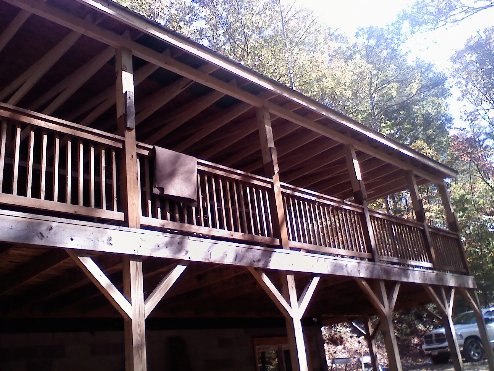 Timber framing under a new elevated porch and deck — Roof Leak Repair in Traverse City by Roofing Brothers